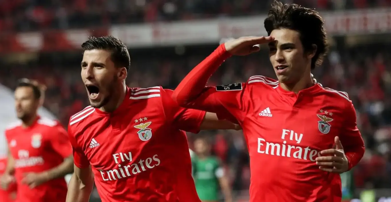 Benfica players celebrating on the pitch — image for 1xBet Registration page